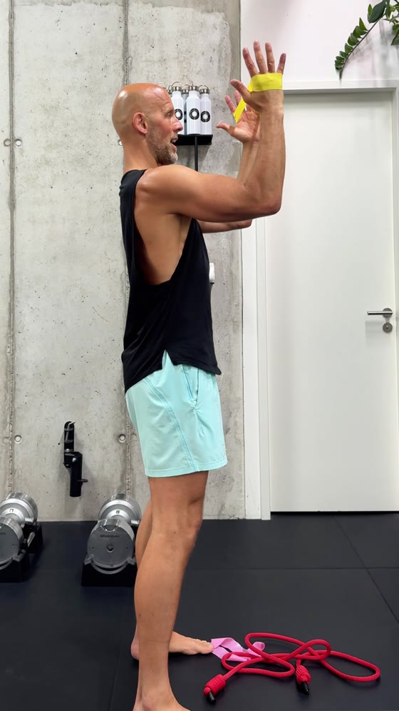 Full elevation: your arms are up, your shoulders stay down.
